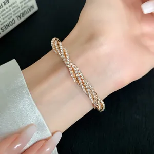 Close-up of elegant multi-layer twisted bracelet with sparkling pavé rhinestones.