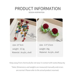 Detail view of heart shell tassel earrings and studs with size and material specifications.