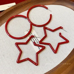 Elegant Ancora red star and hoop earrings set displayed on a minimalist tray