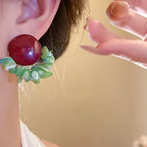 Vintage-style earrings with burgundy round studs and green shell bead fringe