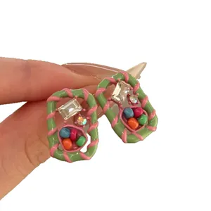 Hand-held colorful geometric stud earrings with rhinestones and candy-inspired enamel
