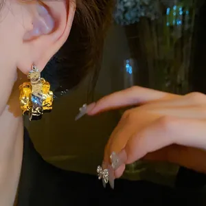 Fashion textured gold and silver double-layered hoop earrings with a metallic finish