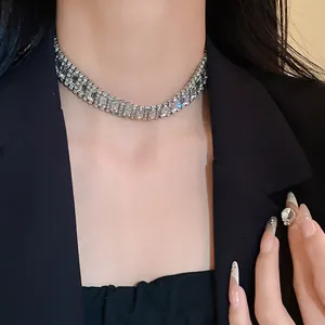 Detail of silver-toned rhinestone choker necklace with geometric crystal accents