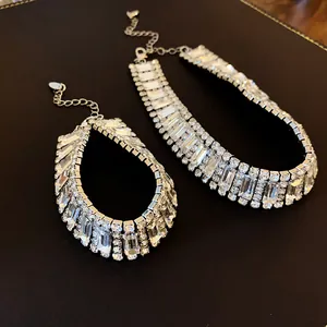Close-up detail of luxury silver-toned geometric crystal choker necklace set for women