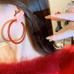 Large red resin hoop earrings with a chic luxury design for festive fashion style