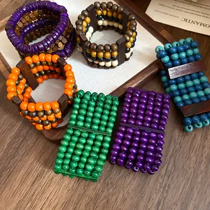 Detailed macro shot of bohemian multi-layer wooden bead bracelets in vibrant colors