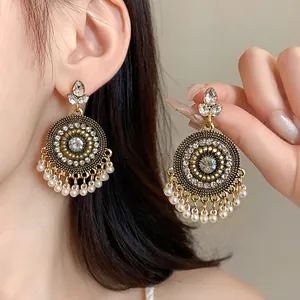 Vintage ethnic style round tassel earrings with rhinestones and pearl fringe display
