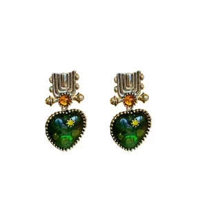Vintage-style silver-tone heart drop earrings with faceted green and amber stones