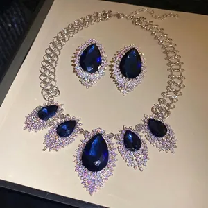Luxury royal blue teardrop necklace and earring set with shimmering crystal accents