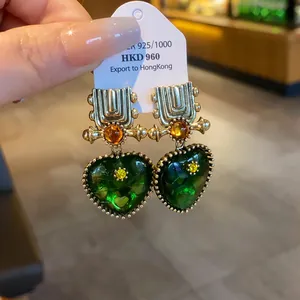 Vintage style green resin heart geometric drop earrings with gold-tone hardware detail