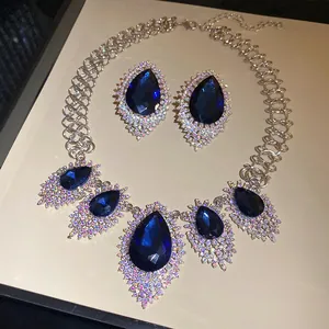 Close-up of an elegant blue waterdrop jewelry set featuring sparkling rhinestone details.