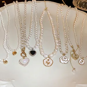 Elegant French style pearl necklace collection with iridescent heart and rose charms