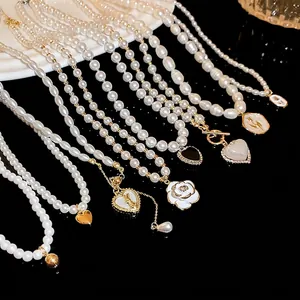 Elegant pearl necklaces with heart and flower pendants in French vintage style for women.