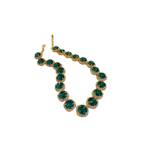 Luxury gold-plated necklace with emerald crystals and rhinestone halo design
