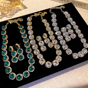 Luxury geometric rhinestone necklace and earring set with green and clear crystal gems
