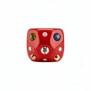 Elegant chunky red resin ring featuring multi-colored embedded rhinestones on white background