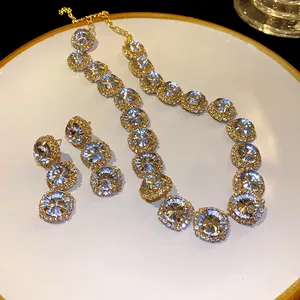 Detailed macro view of elegant rhinestone geometric necklace and matching earring set