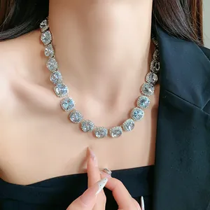 Detailed close-up view of a sparkling rhinestone clavicle necklace on a model's neck