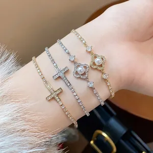 Σετ βραχιόλια με ζιργκόν επίχρυσα 18k με σχέδια σταυρού και λουλουδιών