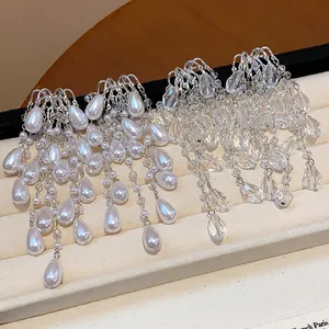 Detailed view of elegant French palace style waterdrop tassel pearl and crystal earrings