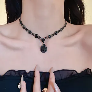 Elegant black rhinestone choker necklace featuring a gothic teardrop pendant detail