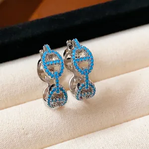 Elegant silver hoop earrings featuring blue stones in a vintage pig nose anchor chain design