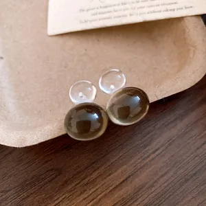 Macro view showing the translucent jelly resin texture of these gourd earrings.