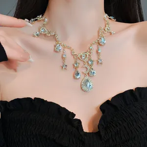 Close-up detail of retro heart and moon necklace with sparkling crystals and pearls
