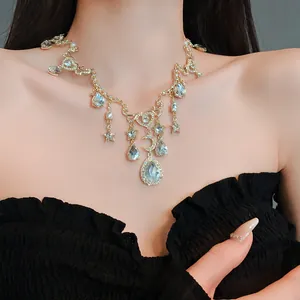 Detailed macro view of vintage gold necklace with rhinestone heart moon and star charms