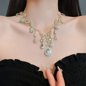 Detailed view of an elegant vintage heart moon rhinestone necklace worn on a model's neck