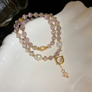 Elegante bracciale a doppio strato con perle occhio di gatto rosa, cristalli e perle