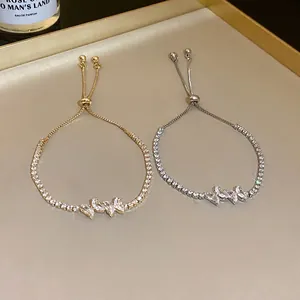 Elegant zircon butterfly adjustable pull-string bracelet in gold and silver finish.