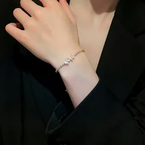 Elegant leaf design zircon bracelet with adjustable pull-string on a female wrist