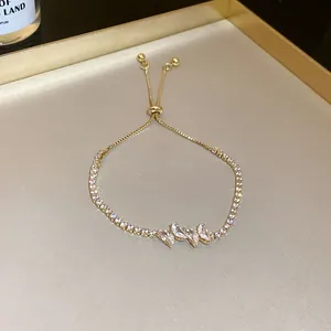 Close-up of elegant gold slider bracelet with sparkling marquise-cut zirconia stones