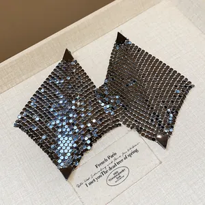 Close-up detail of stylish gunmetal square mesh earrings featuring triangle corner studs