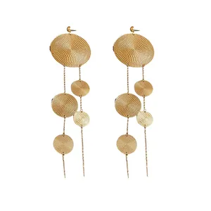 Large gold textured disc tassel drop earrings with unique and exaggerated avant-garde design