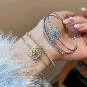 Close-up of elegant double-layer zircon flower bangle showing intricate petal details