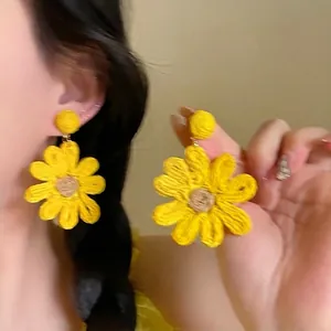 Handmade yellow woven flower stud earrings for vacation bohemian style