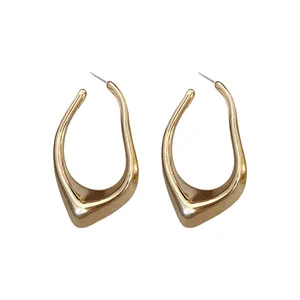 Minimalist irregular geometric hollow hoop earrings in a polished gold finish.