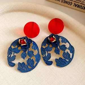 Vintage red resin and blue enameled floral leaf drop earrings for women.