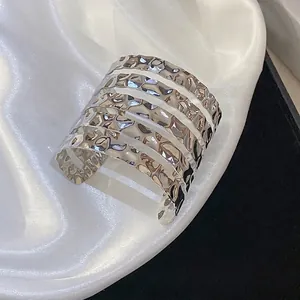 Irregular hammered silver open cuff bracelet with minimalist multi-band geometric design