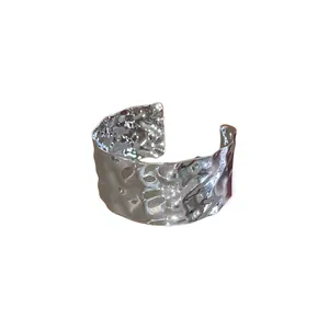 Elegant silver hammered irregular cuff bracelet featuring a minimalist wrinkled metal design