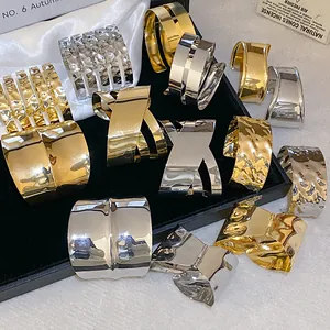 Elegant set of irregular geometric metallic open cuff bracelets in gold and silver finishes