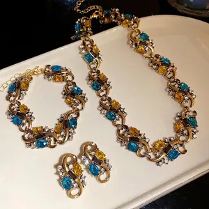 Vintage court style jewelry set with oval blue and yellow crystals and rhinestones