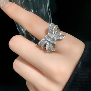 Close-up of elegant silver bow ring with sparkling cubic zirconia on a hand