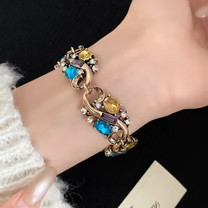 Detailed close-up of a vintage palace style bracelet with colorful oval rhinestones