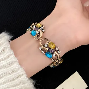Vintage palace style bracelet with colorful rhinestones and crystals in antique gold finish