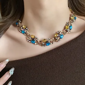 Detailed view of a vintage palace style necklace with multi-colored oval rhinestones