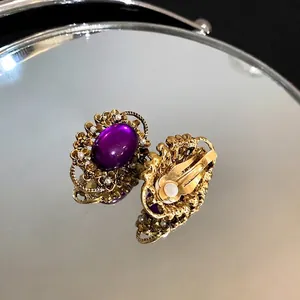 Vintage French gold-plated clip-on earrings with purple oval stone and tiny pearls