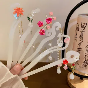 Detail view of elegant New Chinese style floral hairpins with pearl tassels for Hanfu